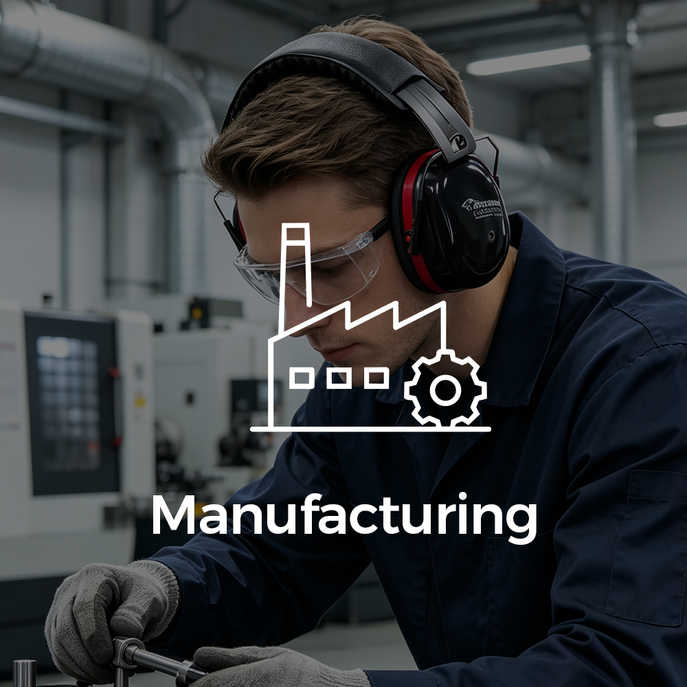 Manufacturing worker wearing Cushentra™ hearing protection earmuffs in an industrial facility
