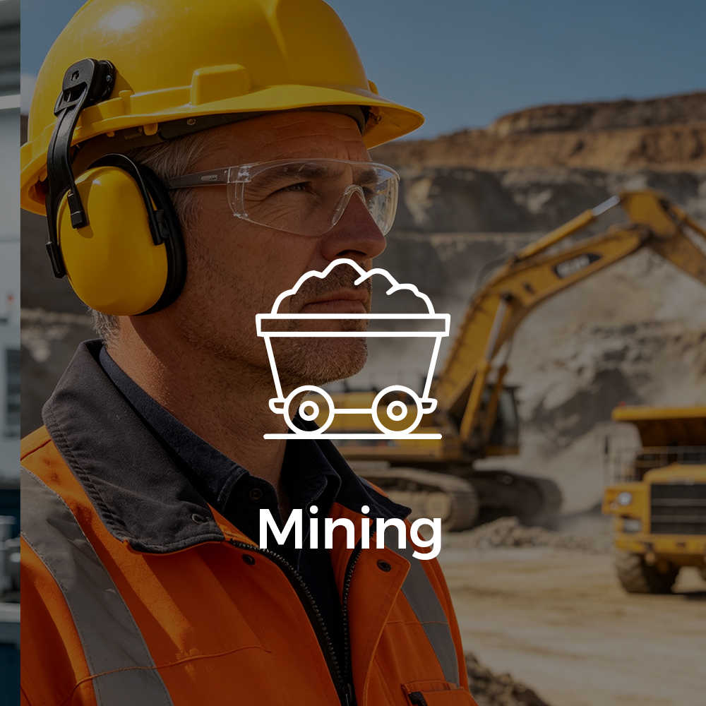 Mining worker wearing PressureFlex™ headband earmuffs for long-term hearing protection at an open-pit mine